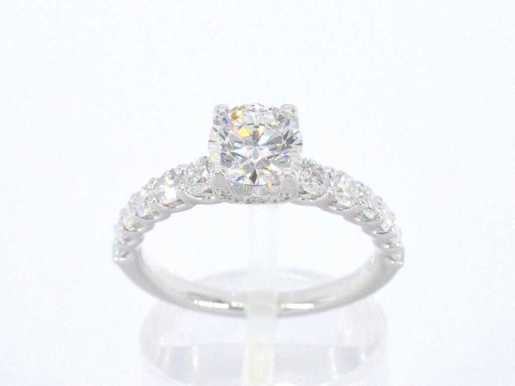 White gold solitaire ring with 1.00 carat brilliant-cut center stone and brilliant-cut diamonds