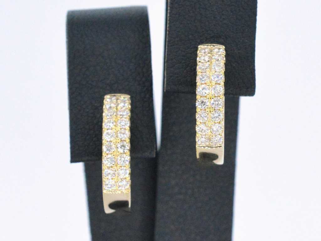 Gold hoop earrings with two rows of diamonds