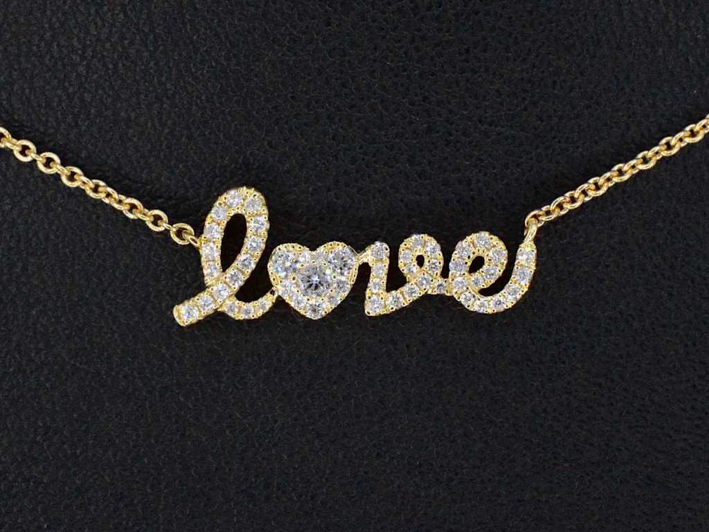Gold 'love' necklace with diamonds