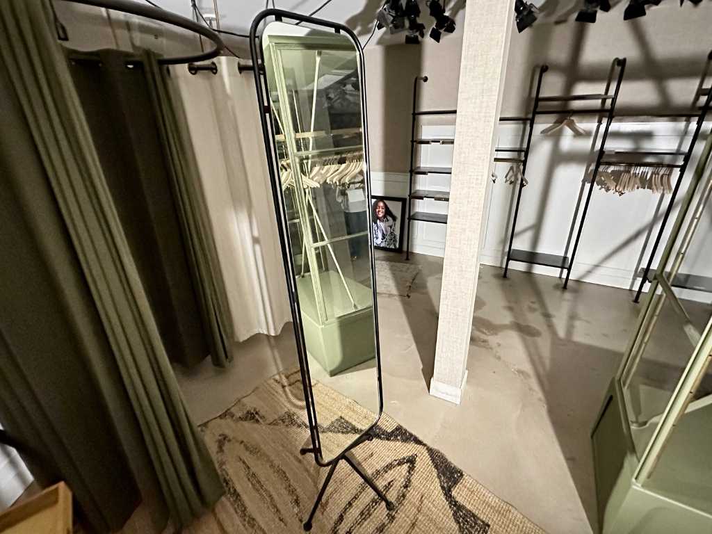 Full-length mirror on steel stand