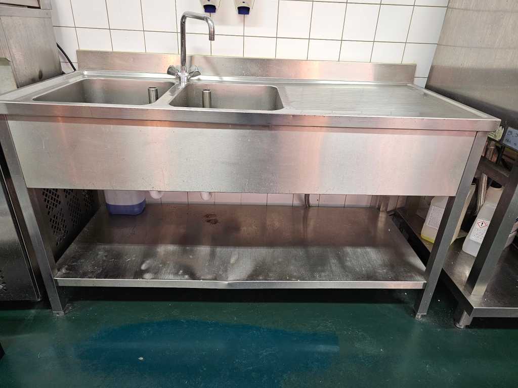 Stainless steel sink with tap
